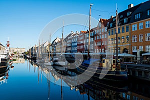 Nyhavn pier with buildings and boats reflected in water, Copenhagen, Denmark ÃâÃÂ ÃâÃÂ 